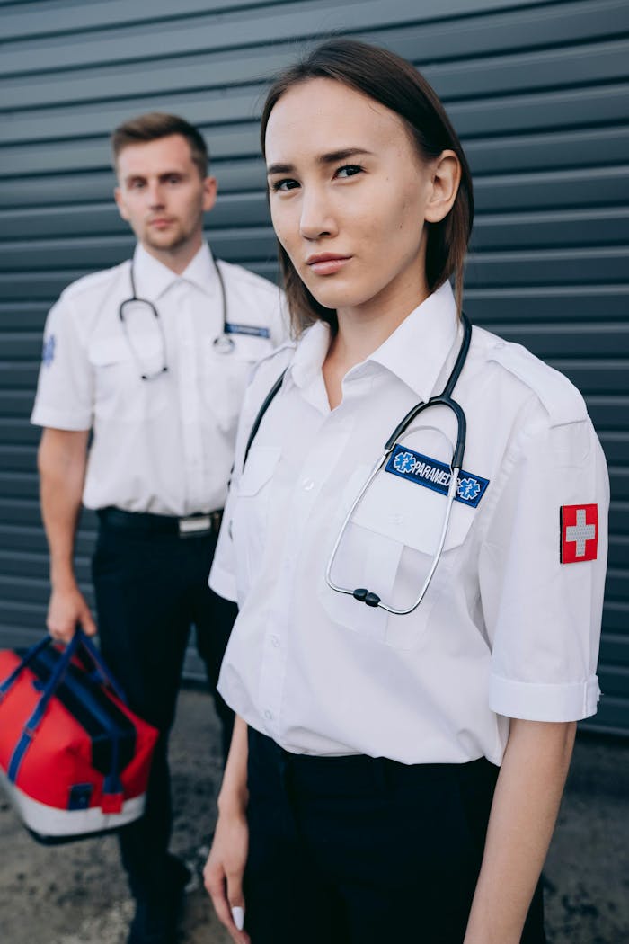 Two people in uniform standing next to each other